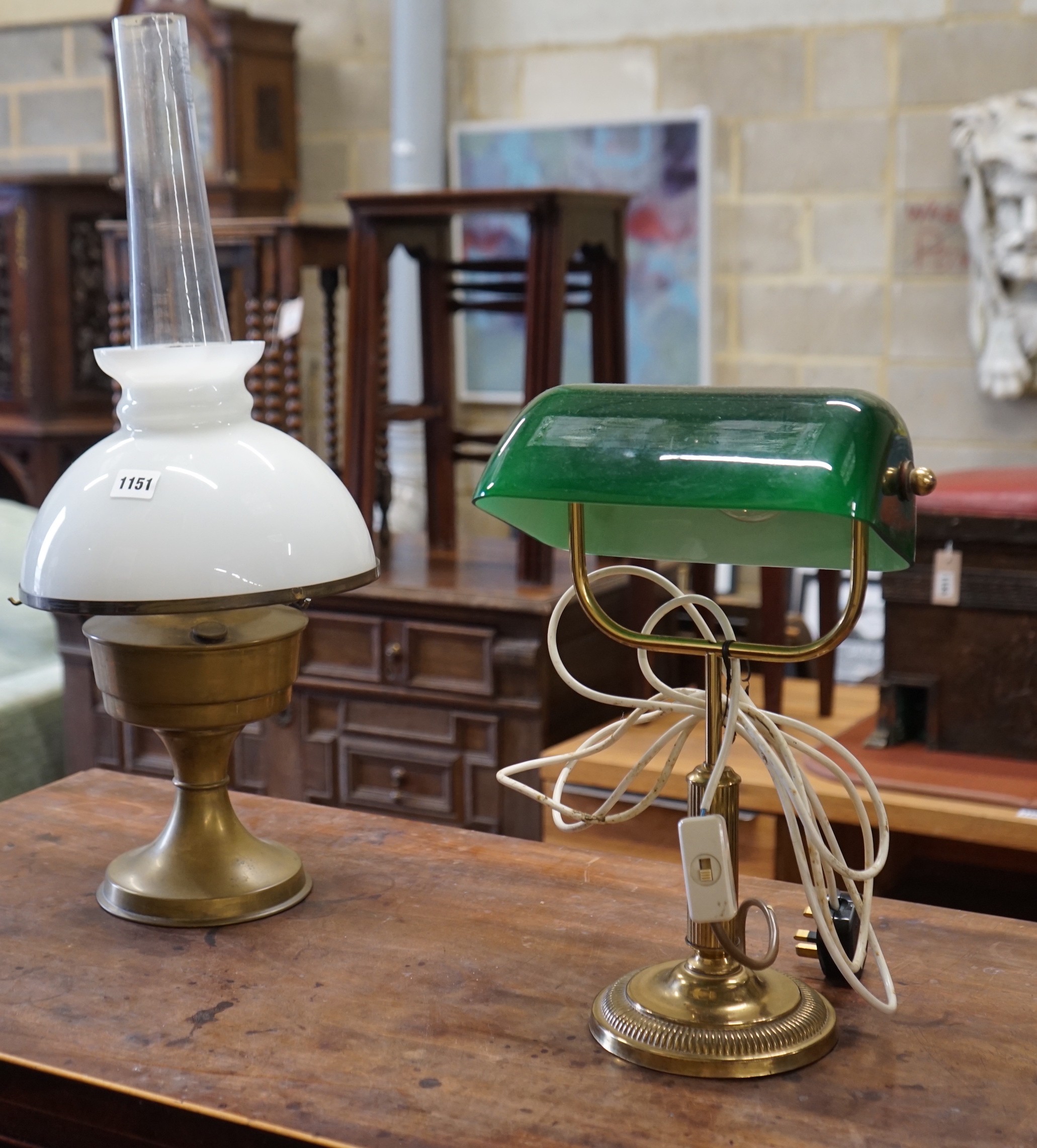 A Victorian style brass reading lamp with green glass shade, height 39cm together with a brass and opaque glass oil lamp